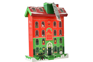 3/4 view of English Tea Shop Sip the Season Christmas Tea House advent calendar box on a white background.