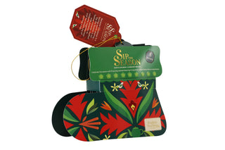 3/4 side angle view of English Tea Shop green Santa's Stocking tea gift box isolated on a white background.
