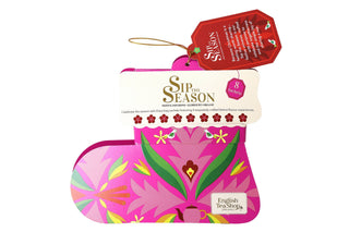 Direct front view of English Tea Shop pink Santa's Stocking organic tea gift box on a white background.