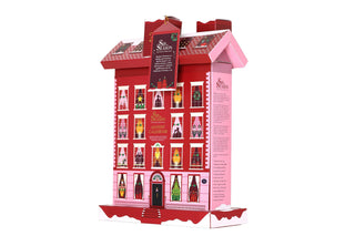Three-quarter right side angle view of English Tea Shop Townhouse Advent Calendar box showing side panel details on a white background.